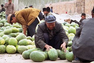 45 Kashgar Sunday Market 1993 Selling Melons.jpg